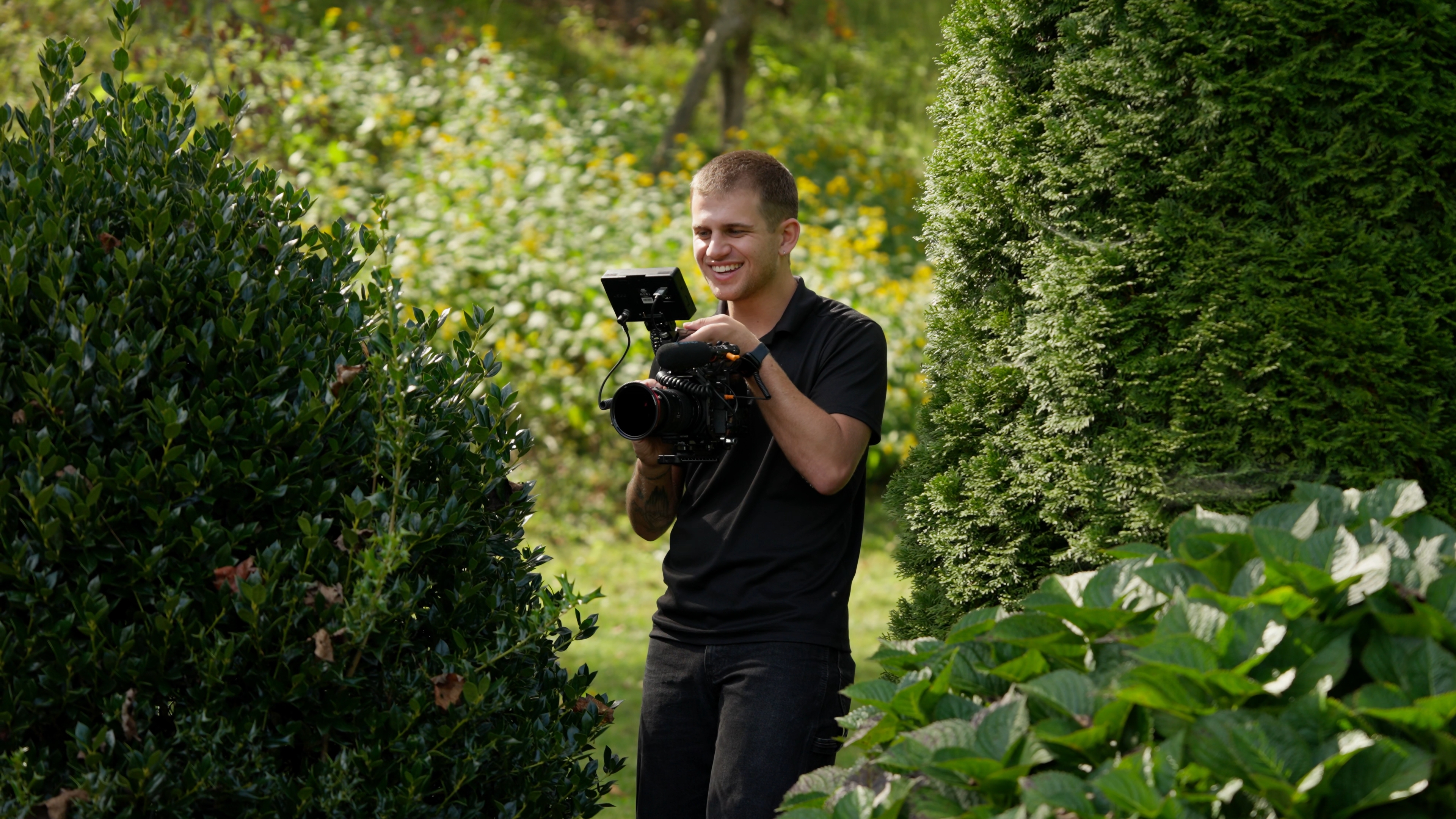 Jake Bensulock, Asheville NC wedding videographer, shooting a wedding